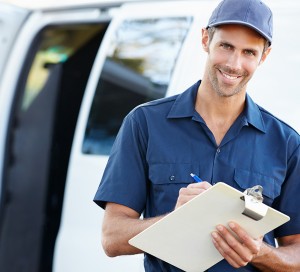 Portrait Of Delivery Driver With Clipboard